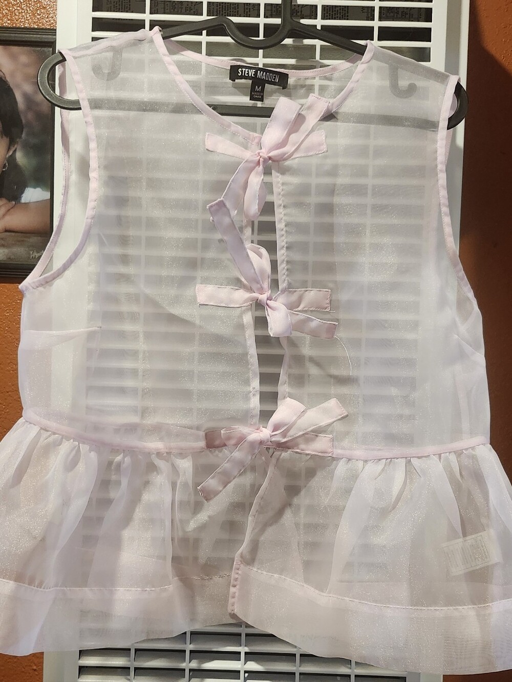 Steve Madden Sheer Bow-Tie Sleeveless Peplum Top in Light Pink